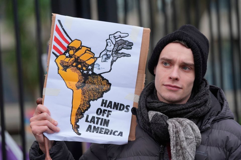 A protester outside the US embassy in Dublin yesterday. Photo: PA